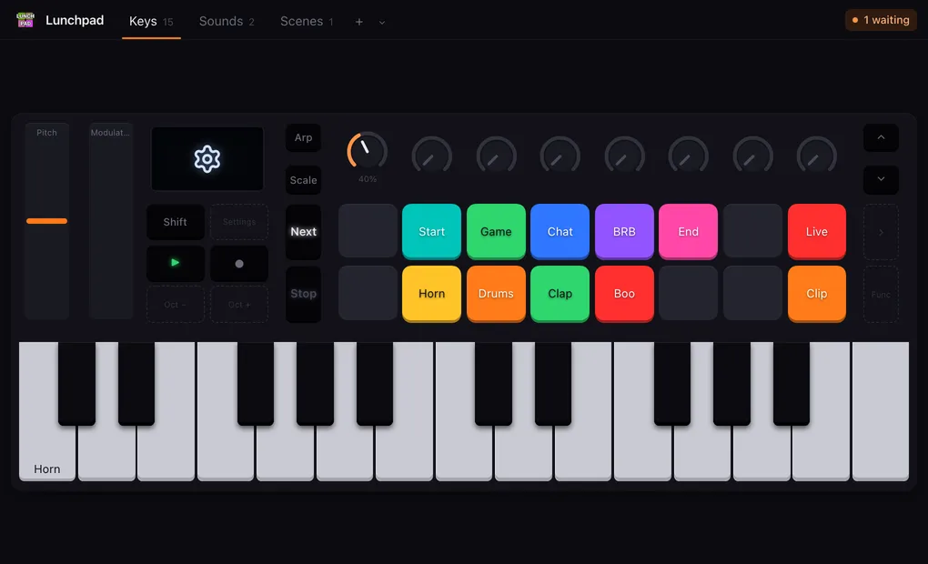 A Launchkey Mini MK4 in Lunchpad: the pitch and modulation strips at the left, the screen showing the settings gear, Shift and the transport buttons, Arp and Scale, eight encoders over the two rows of pads, the track buttons beside them, and the keys along the bottom.